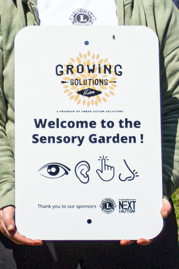 drive-swim-fly-chicago-windy-city-lions-club-urban-autism-solutions-sensory-garden-sign