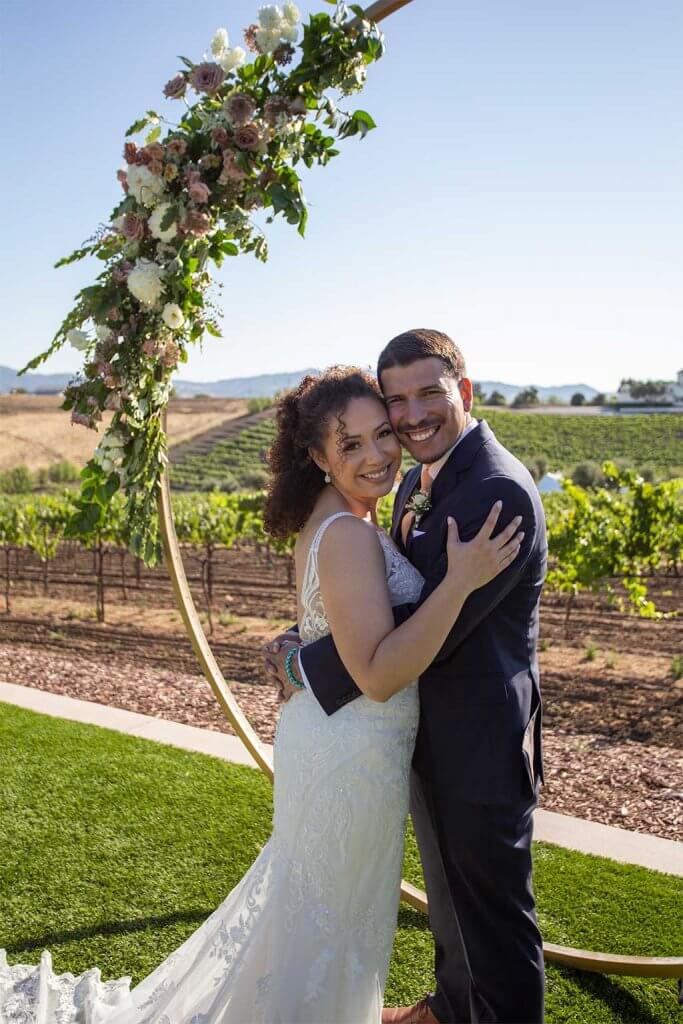 drive-swim-fly-wedding-photography-hollister-california-leal-vinyards-sandy-matthew-wedding-bride-groom-hugging