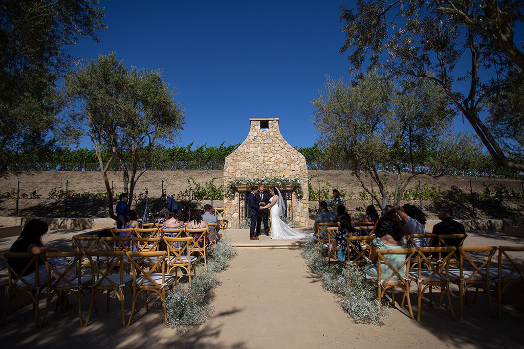 drive-swim-fly-wedding-photography-hollister-california-leal-vinyards-sandy-matthew-wedding-ceremony-fireplace