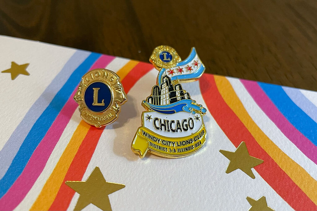 drive-swim-fly-lions-club-chicagoland-chicago-windy-city-lions-enamel-pins
