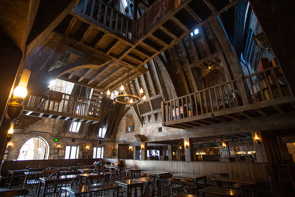 drive-swim-fly-universal-studios-hollywood-california-harry-potter-world-hogsmeade-three-broomsticks-tavern-restaurant-vaulted-ceilings-wooden