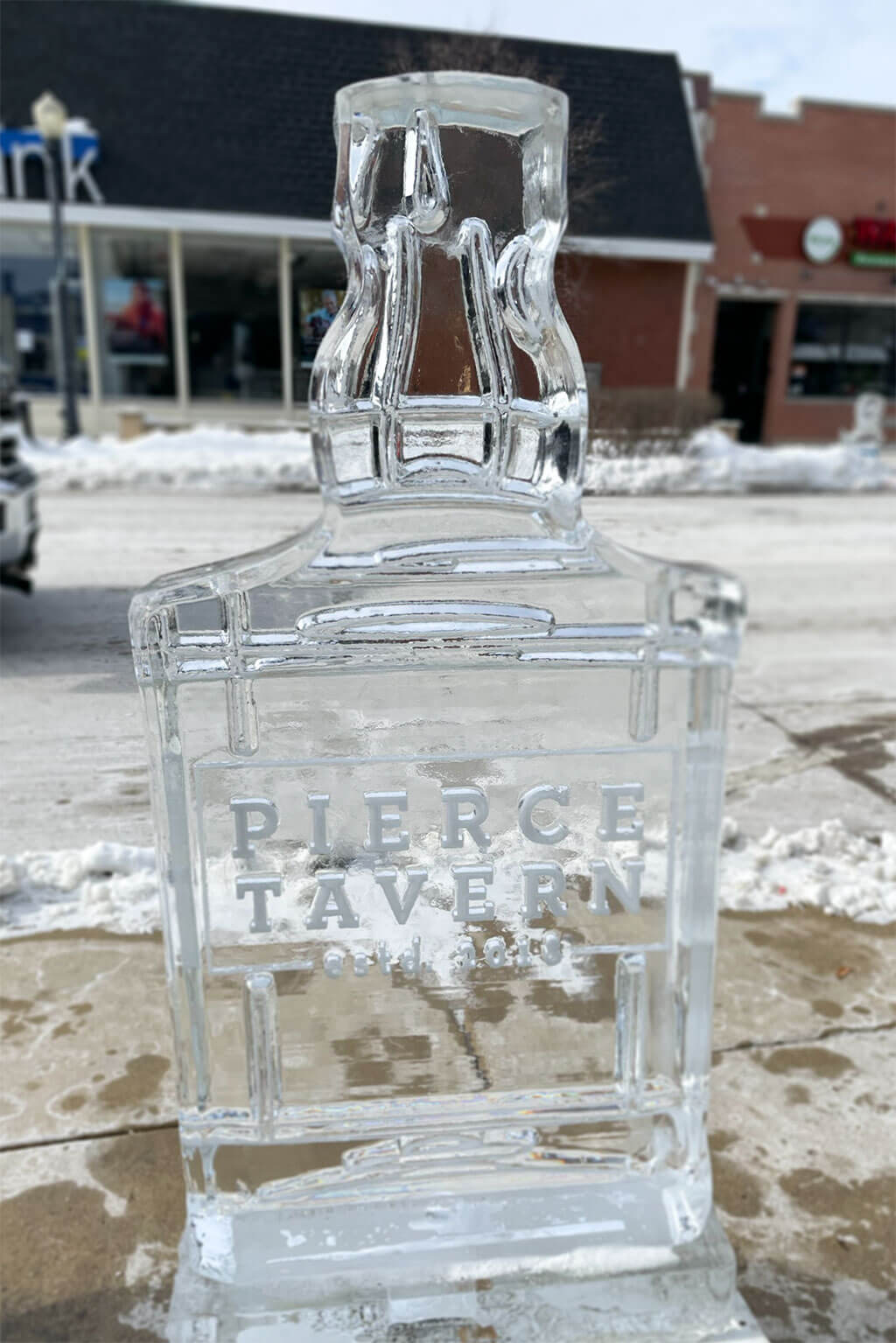drive-swim-fly-downers-grove-chicago-illinois-ice-sculpture-downtown-businesses-pierce-tavern-whiskey-bottle
