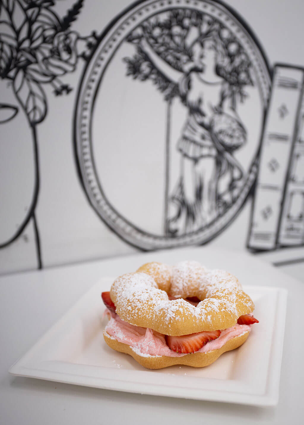 drive-swim-fly-chicago-illinois-2d-restaurant-cartoon-black-and-white-cafe-mochi-donut-strawberry-frosting