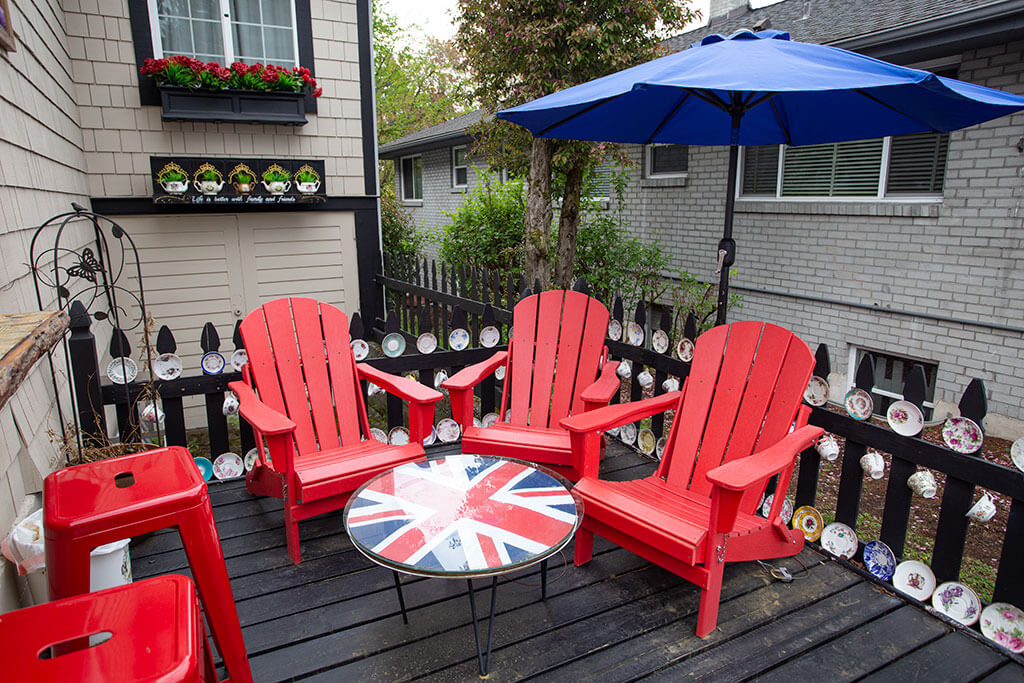 drive-swim-fly-seattle-washington-queen-mary-tea-room-british-great-britain-red-chairs-porch-afternoon-tea