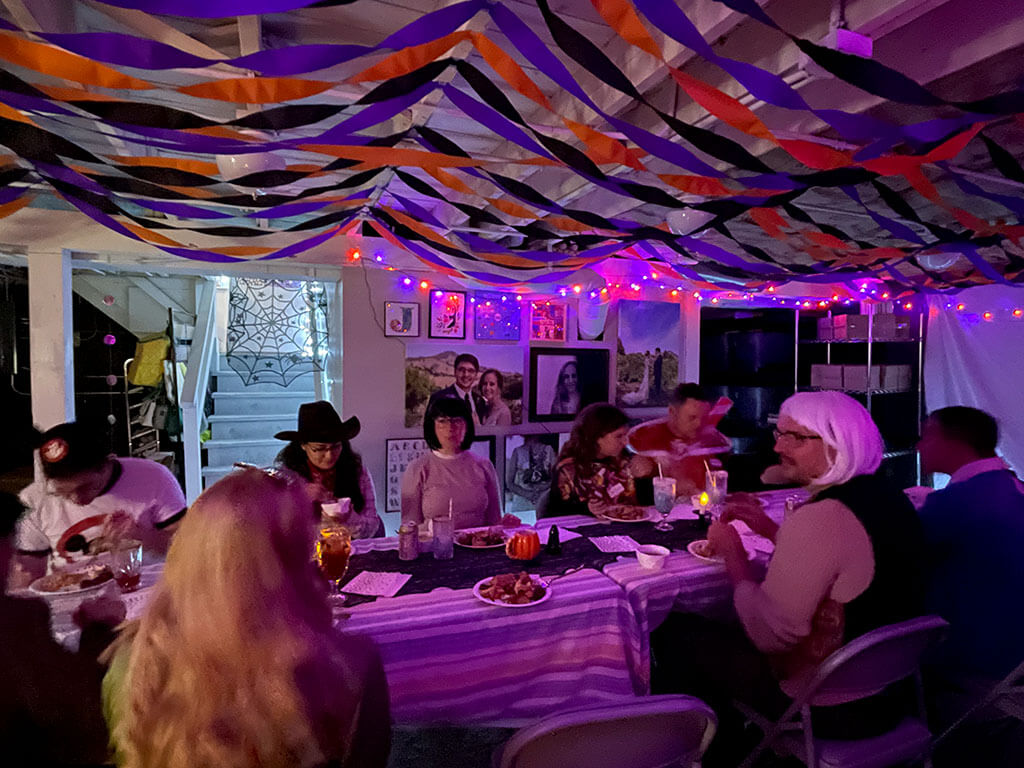 drive-swim-fly-halloween-party-dinner-purple-light-streamers-halloween-string-lights