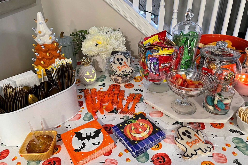 drive-swim-fly-halloween-party-snack-table-spooky-tablecloth-party-napkins-food-header